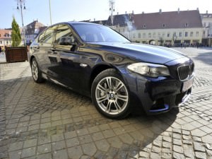 FOTO: Iohannis conduce un BMW M5 unic în România şi care costă 100.000 de euro