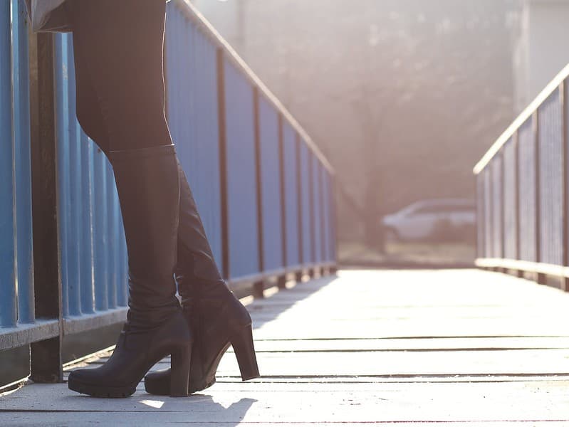 woman standing on bridge