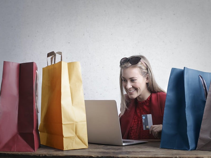 happy woman shopping online at home